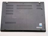a close up of a laptop on a white surface