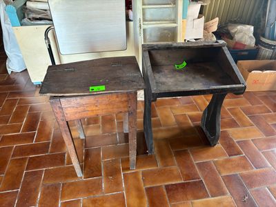 two tables that are sitting on a tile floor