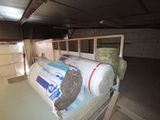 a large roll of insulation sitting on a pallet in a garage
