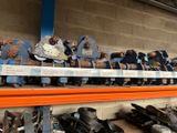many pairs of shoes on a shelf in a store
