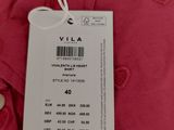 a close up of a red shirt with a tag on it