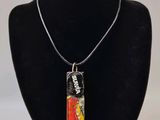 a close up of a necklace on a mannequin neck