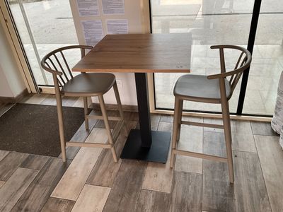 two chairs and a table in the corner of a room