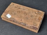 a wooden box with a map on it on a table