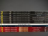 several books stacked on top of each other on a table