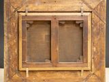 a close up of a wooden frame with a window in it