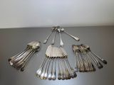 a lot of silver spoons and spoons on a table