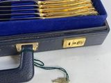 a case with silverware inside of it on a table