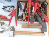 many different tools in a box on a table