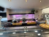 an image of a kitchen with a counter and a pizza on the counter