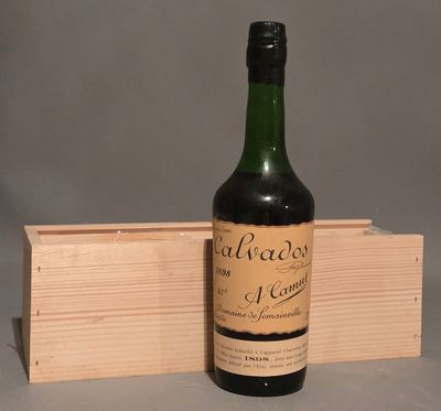 a bottle of wine sitting next to a wooden box