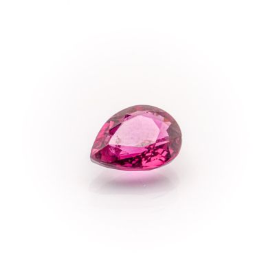 a pink tourmaline gems on a white background