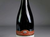 a bottle of wine that is sitting on a table