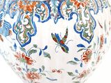 an image of a vase with a butterfly design on it