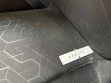 a picture of a seat in a car with a sticker on it