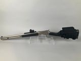 a gun that is sitting on top of a table