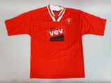the shirt is red and white with a black and red logo on it