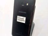 a close up of a cell phone with a sticker on it