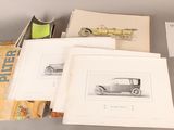 three books with drawings of old cars on them sitting on top of a table