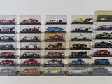 a lot of cars that are on display in a case