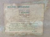 a plaque on the side of a building that says michel degenne