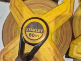 two yellow and black fire hoses sitting on a table