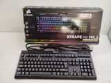a computer keyboard and a mouse on a table