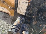 a close up of a machine that is sitting on the ground