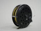 a reel that is sitting on a white surface