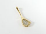 a close up of a spoon on a white surface with a white background