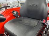 an image of a red tractor with a black seat