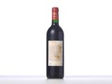 bottle of red wine sitting on a table with a white background