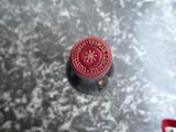 a red fire hydrant sitting on top of a metal table