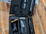 a black case with tools in it on a wooden table