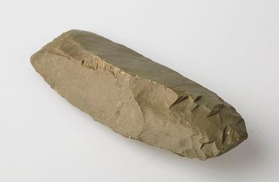 a rock that is sitting on a white surface