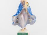 figurine of the virgin mary and child jesus on a pedestal