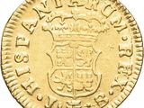 a close up of a gold coin with a crown on it
