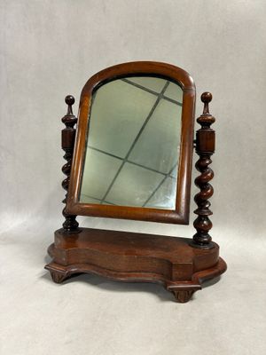 an image of a wooden mirror on a stand on a white background
