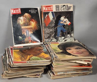 several magazines are stacked on top of each other on a table