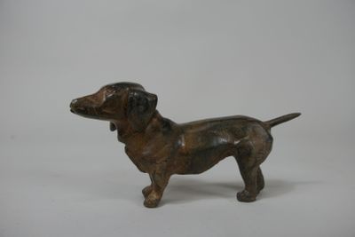 bronze statue of a dog on a white background