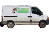 a white van that is parked on the side of the road