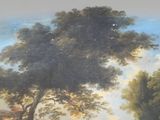 a painting of cows grazing in a field near a tree