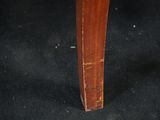 a close up of the legs of a wooden table