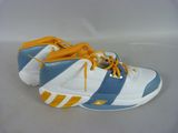adidas shoes with blue and yellow stripes on them on a white surface