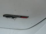 a close up of a car door handle with a red handle