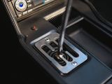 a close up of a car ' s dashboard with a steering control