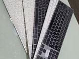 three keyboards sitting on a table next to each other