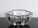 a glass bowl that is sitting on a table