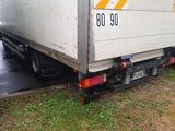 two trucks that are parked next to each other