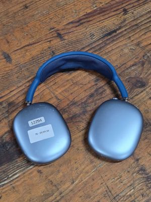 an image of a pair of headphones sitting on top of a wooden floor